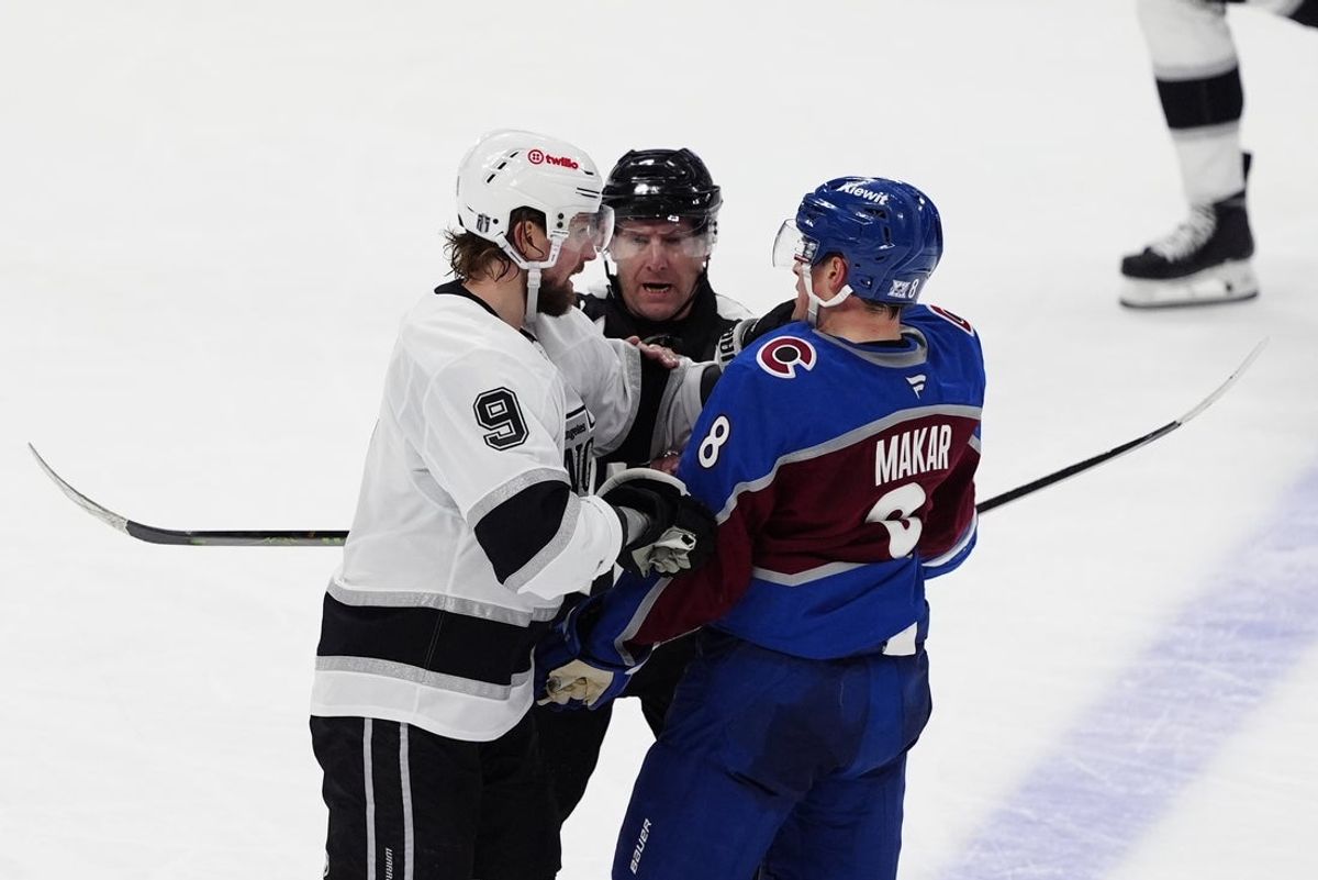 Apr 19, 2026; Denver, Colorado, USA; Los Angeles Kings right wing Adrian Kempe (9) and Colorado Avalanche defenseman Cale Makar (8) fight during the third period in game one of the first round of the 2026 Stanley Cup Playoffs at Ball Arena. Mandatory Credit: Ron Chenoy-Imagn Images