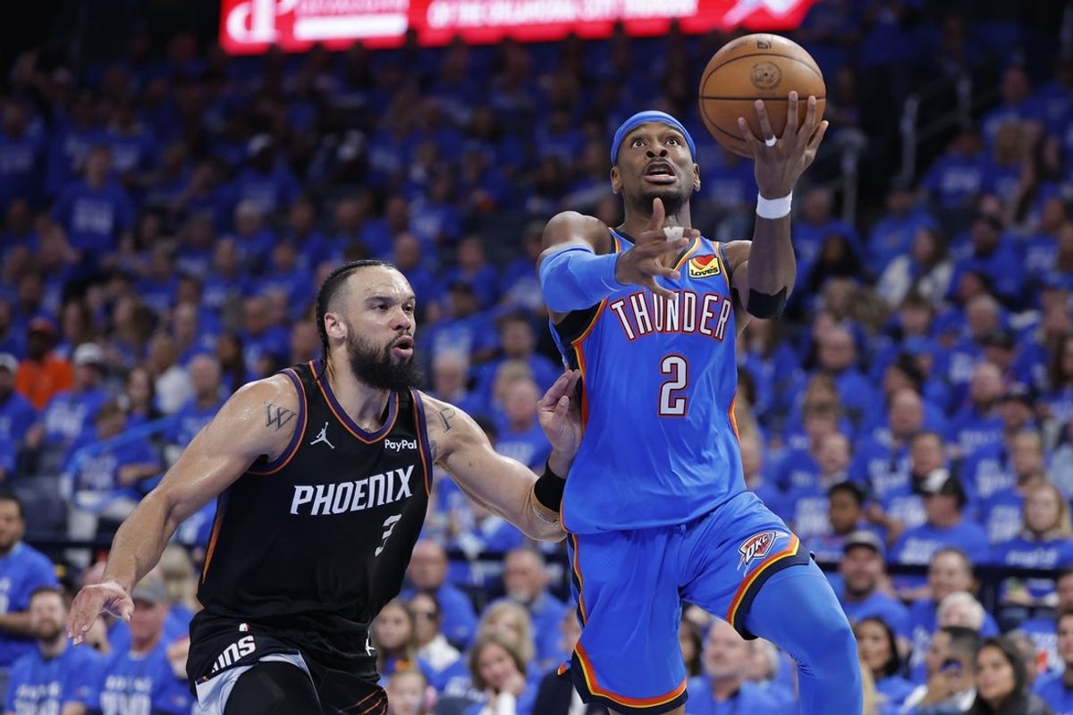 Apr 19, 2026; Oklahoma City, Oklahoma, USA; Oklahoma City Thunder guard Shai Gilgeous-Alexander (2) goes up for a basket beside Phoenix Suns forward Dillon Brooks (3) in the second half during game one of the first round of the 2026 NBA Playoffs at Paycom Center. Mandatory Credit: Alonzo Adams-Imagn Images