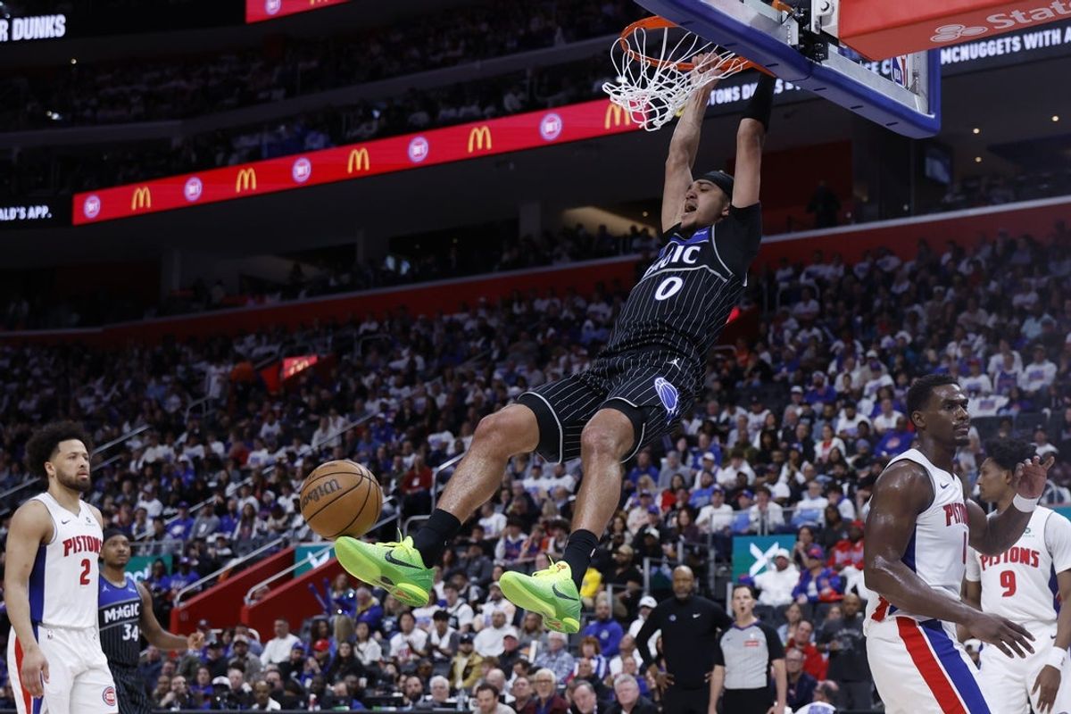 Apr 19, 2026; Detroit, Michigan, USA; Orlando Magic guard Anthony Black (0) dunks in the first half against the Detroit Pistons during the 2026 NBA Playoffs at Little Caesars Arena. Mandatory Credit: Rick Osentoski-Imagn Images
