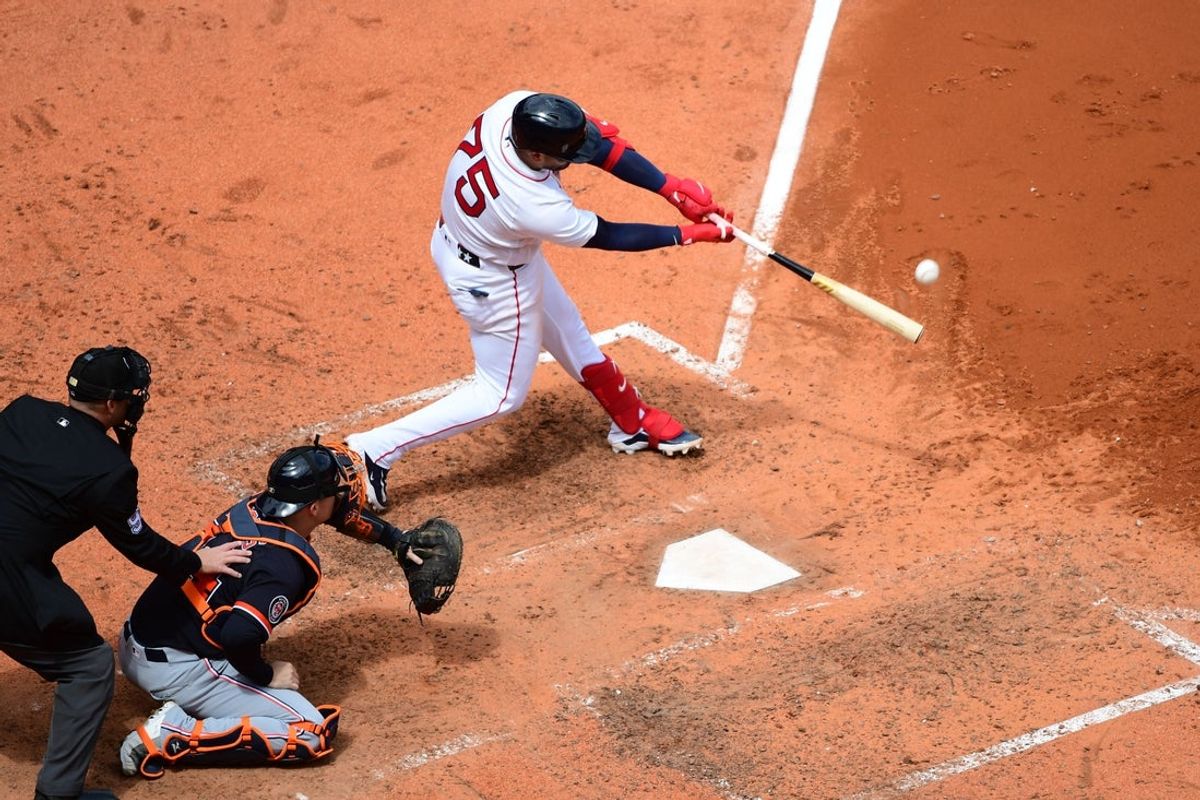 Apr 20, 2026; Boston, Massachusetts, USA;  Boston Red Sox catcher Carlos Narvaez (75) hits a double during the sixth inning against the Detroit Tigers at Fenway Park. Mandatory Credit: Bob DeChiara-Imagn Images