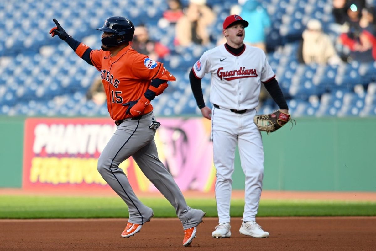 Apr 20, 2026; Cleveland, Ohio, USA; Houston Astros third baseman Isaac Paredes (15) rounds the bases after hitting a home run as Cleveland Guardians first baseman Kyle Manzardo (9) looks on during the fourth inning at Progressive Field. Mandatory Credit: Ken Blaze-Imagn Images