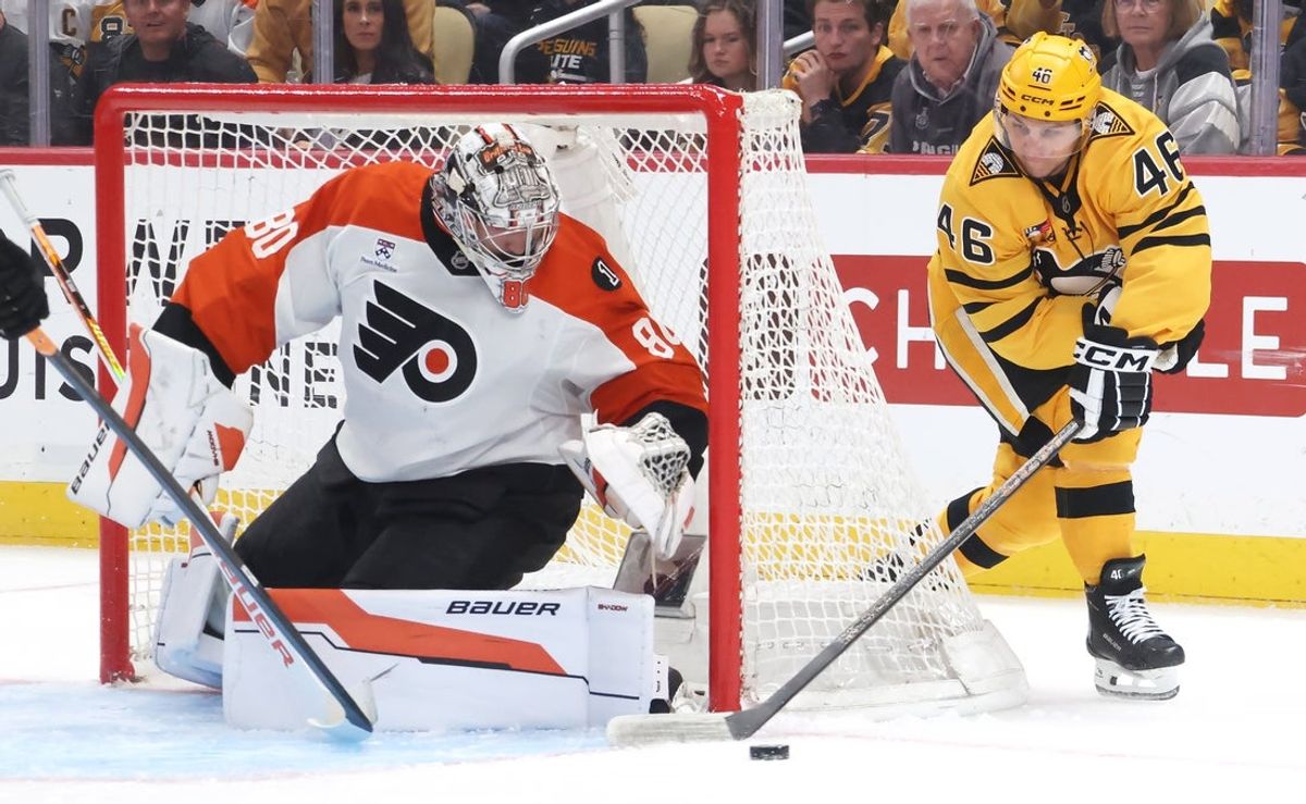 Apr 20, 2026; Pittsburgh, Pennsylvania, USA;  Philadelphia Flyers goaltender Dan Vladar (80) defends the net against a wrap around attempt by Pittsburgh Penguins center Blake Lizotte (46) during the first period in game two of the first round of the 2026 Stanley Cup Playoffs at PPG Paints Arena. Mandatory Credit: Charles LeClaire-Imagn Images