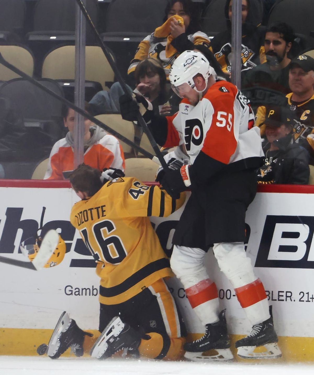 Apr 20, 2026; Pittsburgh, Pennsylvania, USA; Philadelphia Flyers defenseman Rasmus Ristolainen (55) knocks the helmet of Pittsburgh Penguins center Blake Lizotte (46) off during the third period in game two of the first round of the 2026 Stanley Cup Playoffs at PPG Paints Arena. Mandatory Credit: Charles LeClaire-Imagn Images