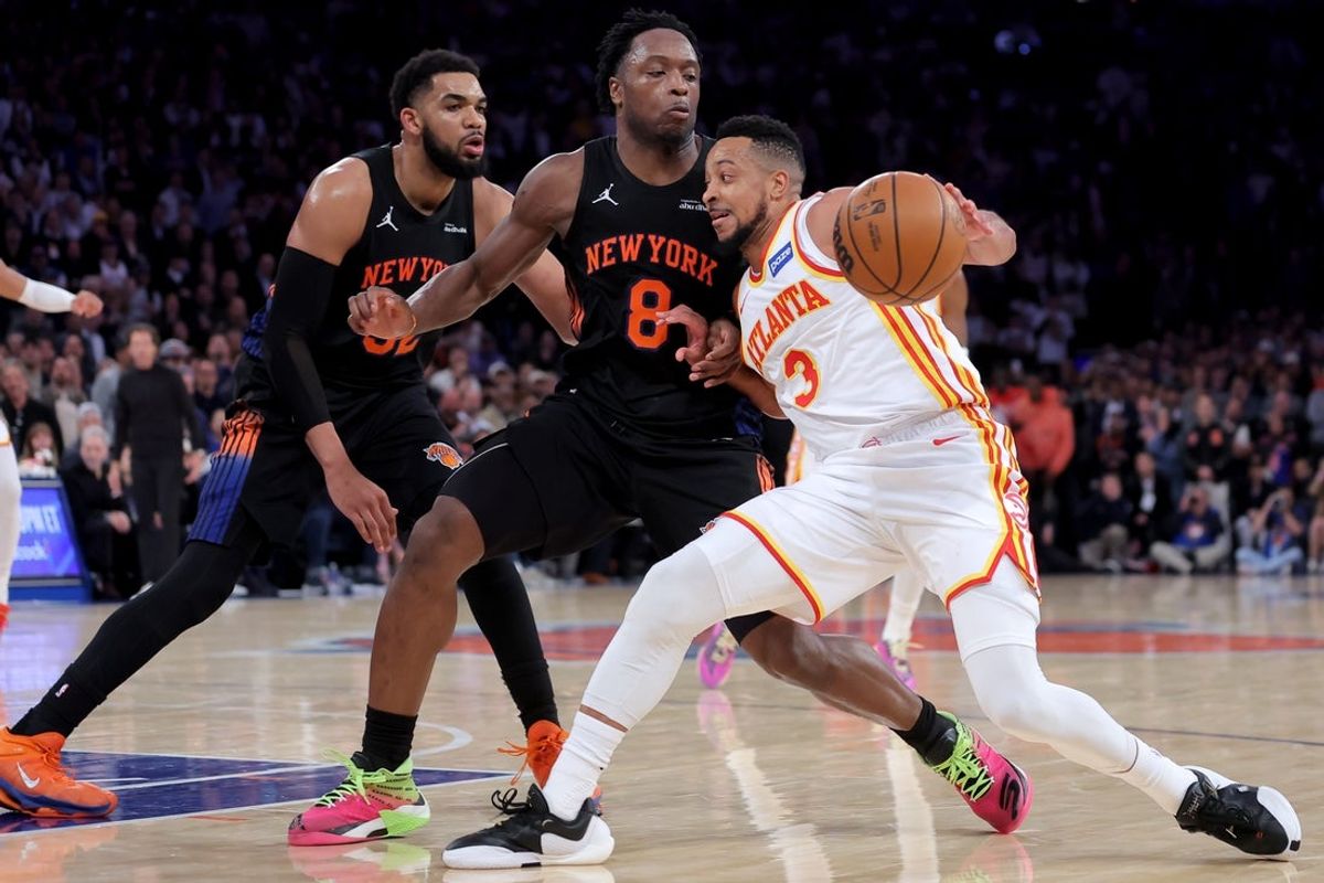 Apr 20, 2026; New York, New York, USA; Atlanta Hawks guard CJ McCollum (3) controls the ball against New York Knicks forward OG Anunoby (8) and center Karl-Anthony Towns (32) during the fourth quarter of game two of the first round of the 2026 NBA Playoffs at Madison Square Garden. Mandatory Credit: Brad Penner-Imagn Images