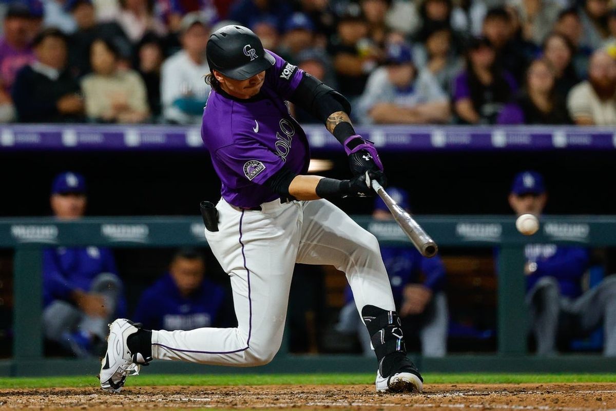 Apr 20, 2026; Denver, Colorado, USA; Colorado Rockies left fielder Jordan Beck (27) hits a single in the seventh inning against the Los Angeles Dodgers at Coors Field. Mandatory Credit: Isaiah J. Downing-Imagn Images