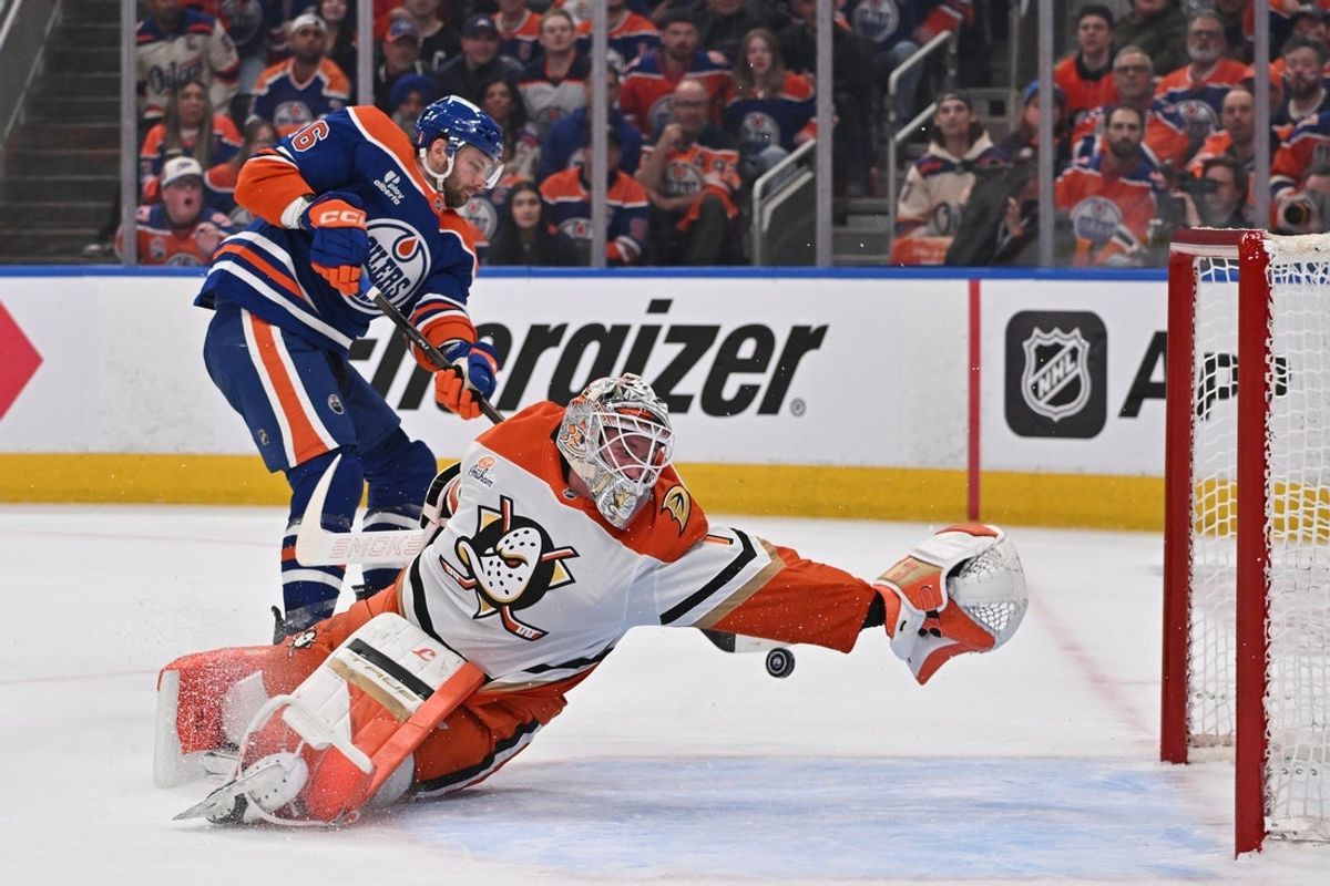 Apr 20, 2026; Edmonton, Alberta, CAN; Edmonton Oilers center Jason Dickinson (16) shoots the puck to Anaheim Ducks goalie Lukas Dostal (1) in game one of the first round of the 2026 Stanley Cup Playoffs during the first period at Rogers Place. Mandatory Credit: Walter Tychnowicz-Imagn Images