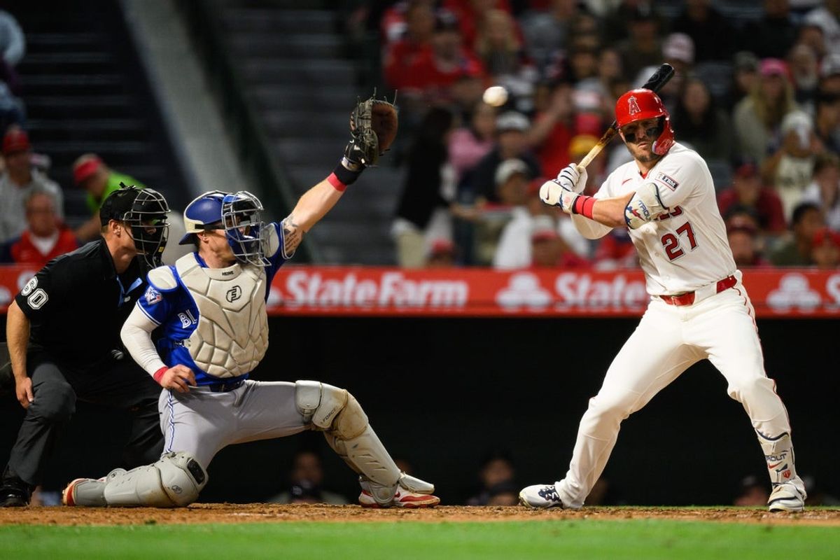 Apr 20, 2026; Anaheim, California, USA; Los Angeles Angels center fielder Mike Trout (27) takes a high pitch during the fifth inning against the Toronto Blue Jays at Angel Stadium. Mandatory Credit: William Liang-Imagn Images