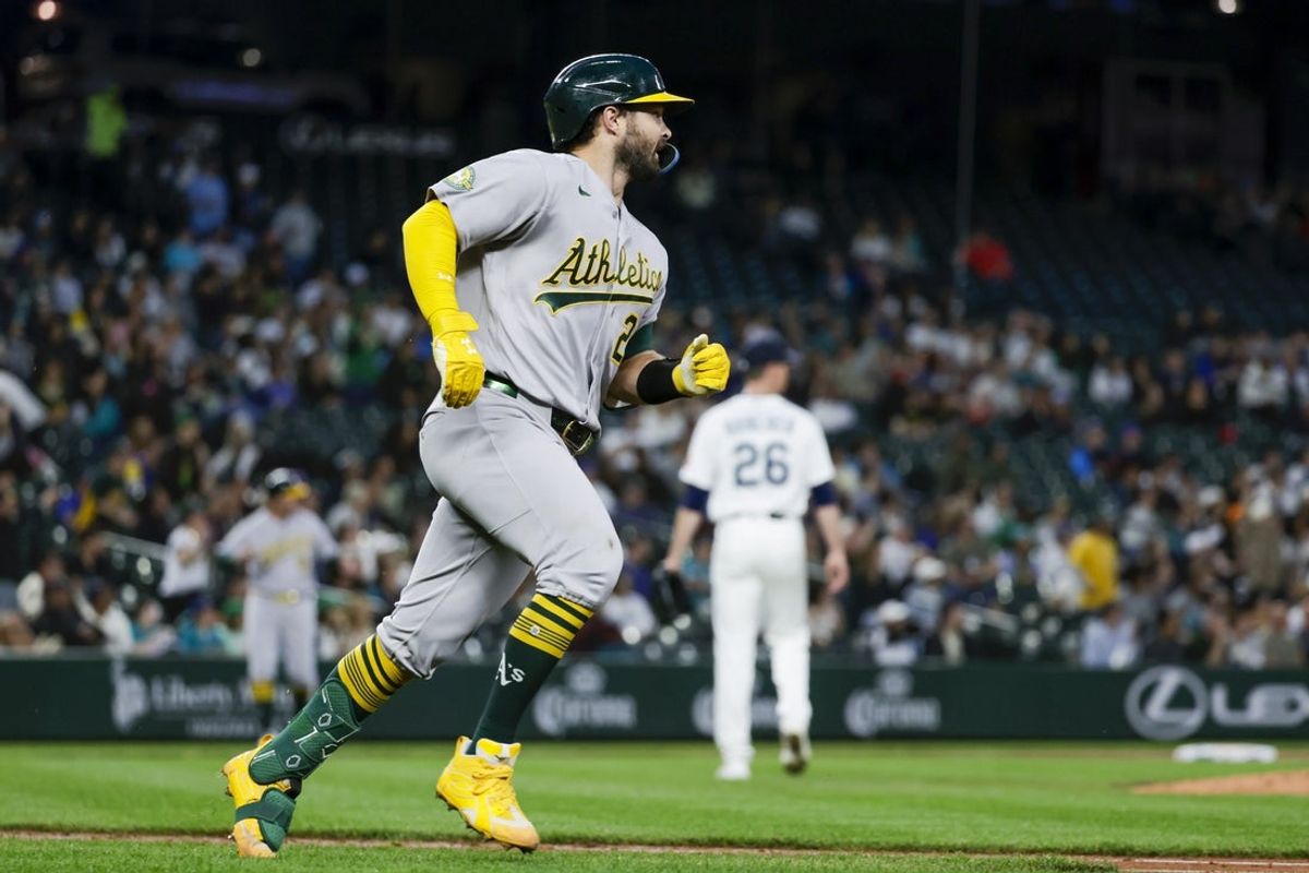 Apr 20, 2026; Seattle, Washington, USA; Athletics catcher Shea Langeliers (23) hits a home run against the Seattle Mariners during the sixth inning at T-Mobile Park. Mandatory Credit: Joe Nicholson-Imagn Images