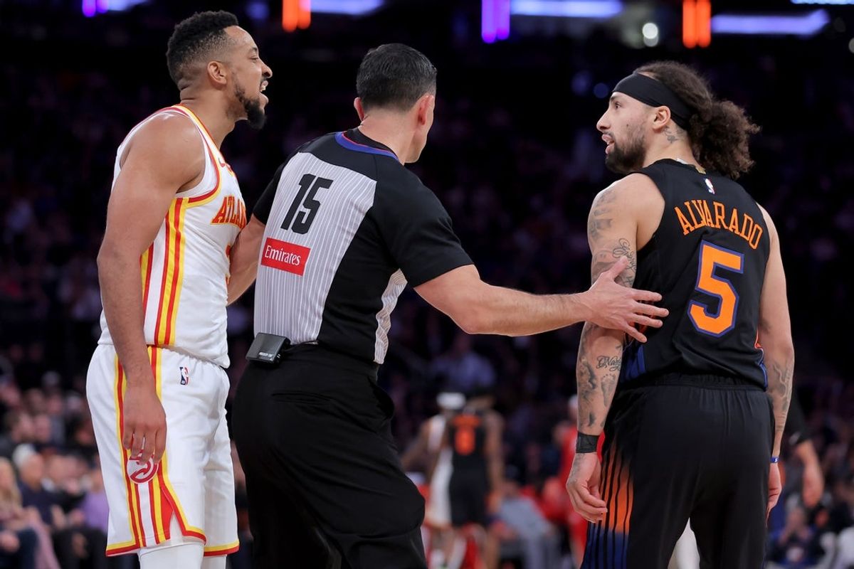 Apr 20, 2026; New York, New York, USA; Atlanta Hawks guard CJ McCollum (3) and New York Knicks guard Jose Alvarado (5) are separated by referee Zach Zarba (15) during the third quarter of game two of the first round of the 2026 NBA Playoffs at Madison Square Garden. Mandatory Credit: Brad Penner-Imagn Images