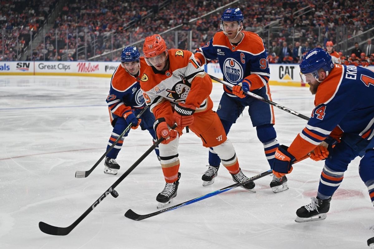 Apr 20, 2026; Edmonton, Alberta, CAN; Edmonton Oilers center Matt Savoie (22) with center Connor McDavid (97) attempt to stop Anaheim Ducks right winger Troy Terry (19) in game one of the first round of the 2026 Stanley Cup Playoffs during the second period at Rogers Place. Mandatory Credit: Walter Tychnowicz-Imagn Images