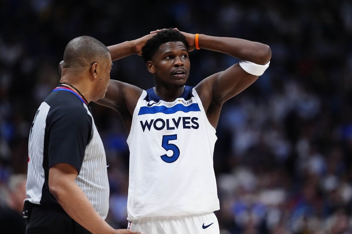 Apr 20, 2026; Denver, Colorado, USA; Minnesota Timberwolves guard Anthony Edwards (5) next to referee Tony Brothers (25) in the second half against the Denver Nuggets during game two of the first round of the 2026 NBA Playoffs at Ball Arena. Mandatory Credit: Ron Chenoy-Imagn Images