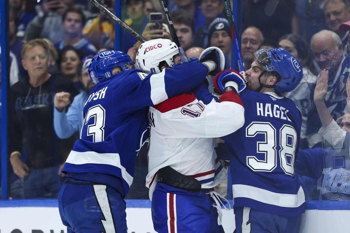 Apr 21, 2026; Tampa, Florida, USA;  Tampa Bay Lightning defenseman Darren Raddysh (43) and left wing Brandon Hagel (38) fight with Montreal Canadiens right wing Josh Anderson (17) during the second period in game two of the first round of the 2026 Stanley Cup Playoffs at Benchmark International Arena. Mandatory Credit: Nathan Ray Seebeck-Imagn Images