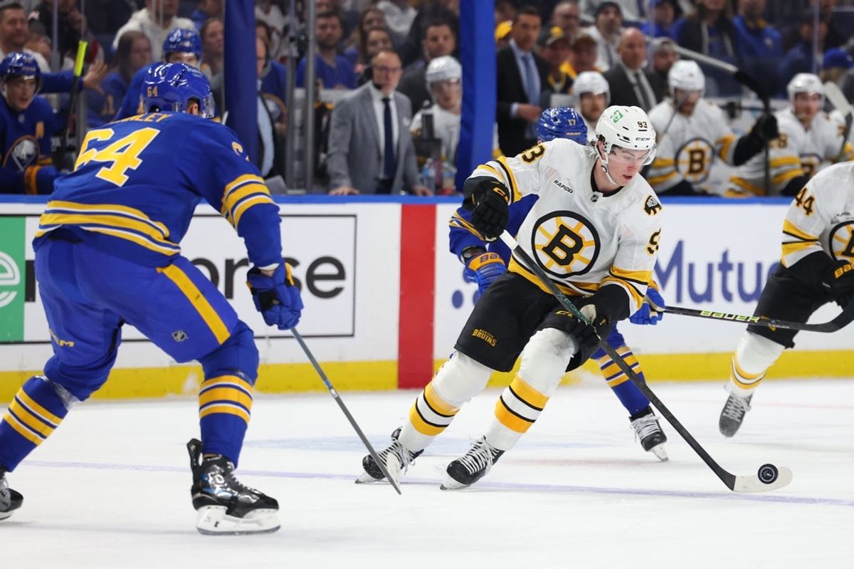 Apr 21, 2026; Buffalo, New York, USA; Boston Bruins center Fraser Minten (93) controls the puck during the first period against the Buffalo Sabres in game two of the first round of the 2026 Stanley Cup Playoffs at KeyBank Center. Mandatory Credit: Timothy T. Ludwig-Imagn Images