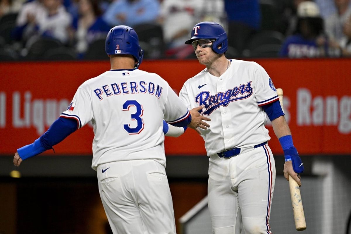 Apr 21, 2026; Arlington, Texas, USA; Texas Rangers designated hitter Joc Pederson (3) celebrates with catcher Danny Jansen (9) after scoring a run against the Pittsburgh Pirates during the second inning at Globe Life Field. Mandatory Credit: Jerome Miron-Imagn Images