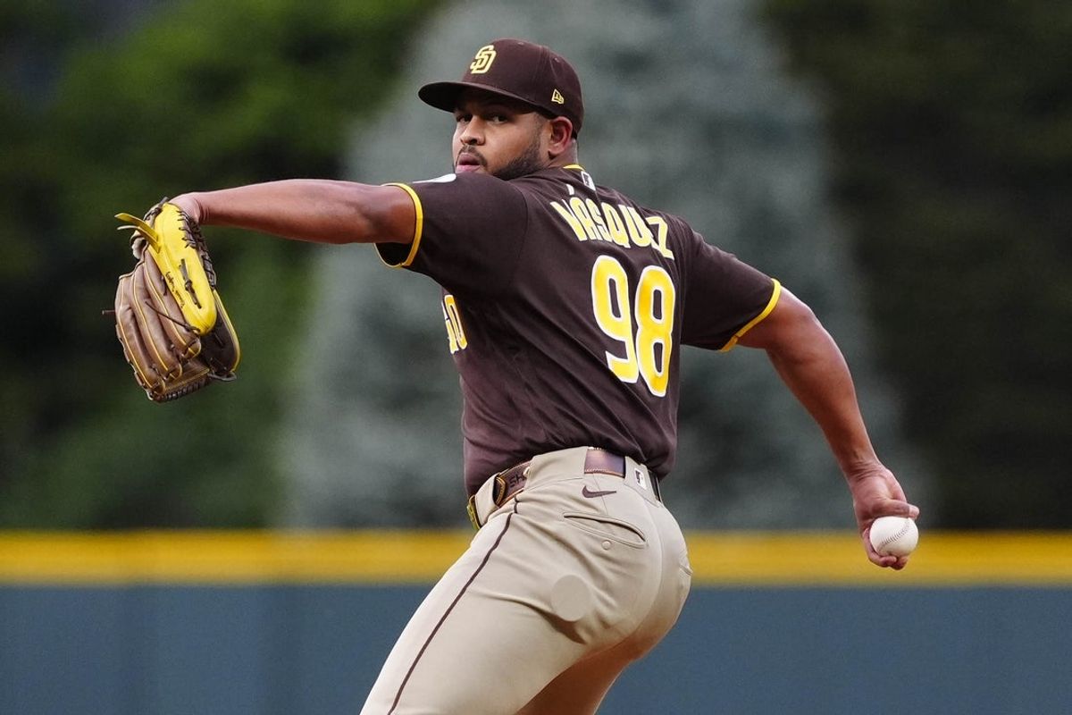 Apr 21, 2026; Denver, Colorado, USA; San Diego Padres starting pitcher Randy Vasquez (98) delivers a pitch in the first inning against the Colorado Rockies at Coors Field. Mandatory Credit: Ron Chenoy-Imagn Images