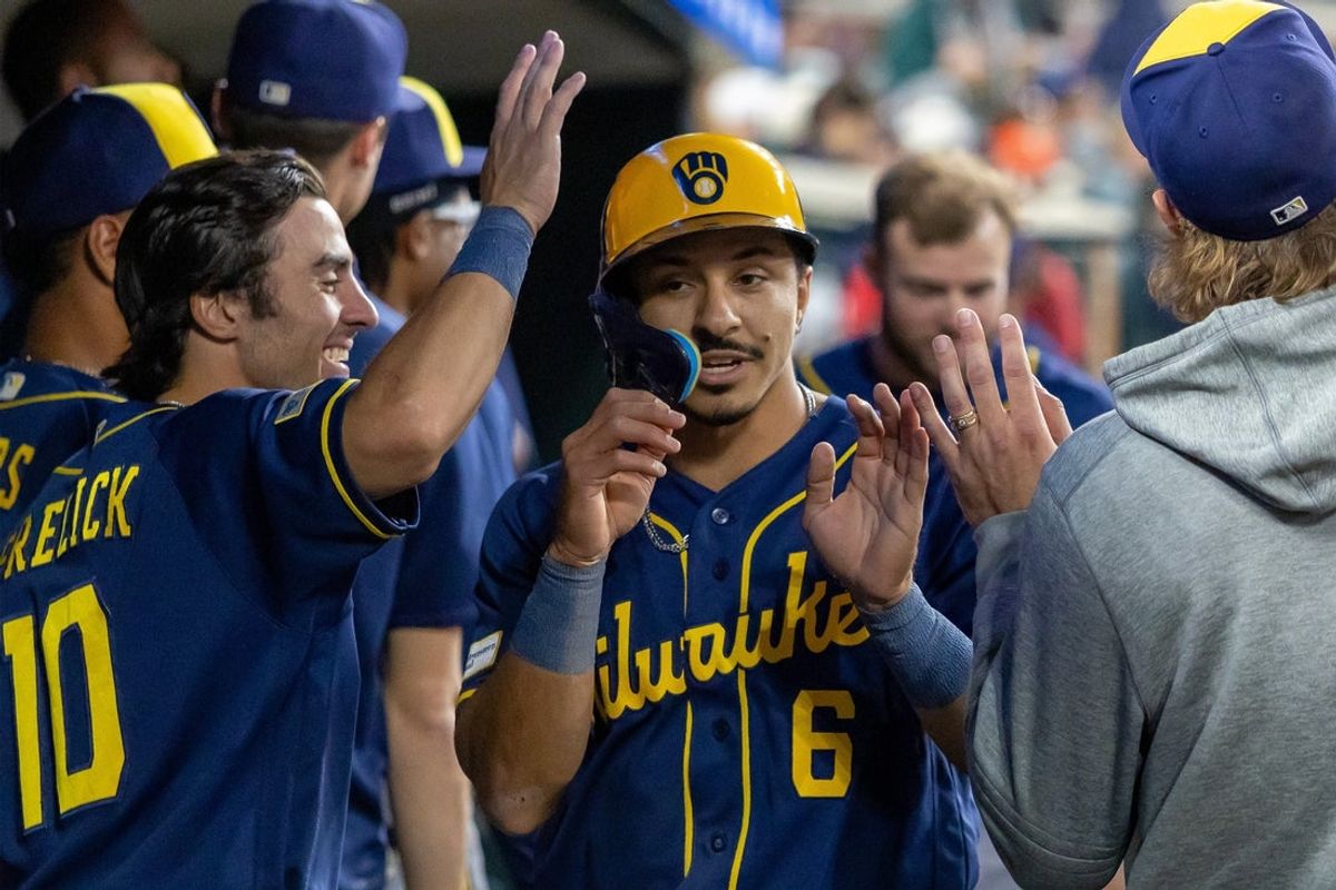 Apr 21, 2026; Detroit, Michigan, USA; Milwaukee Brewers second baseman David Hamilton (6) hi-fives teammates after scoring a run against the Detroit Tigers during the seventh inning at Comerica Park. Mandatory Credit: David Reginek-Imagn Images