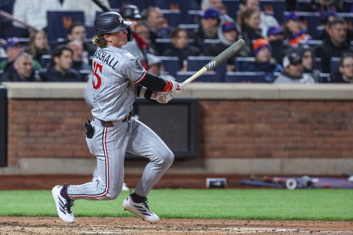 Apr 21, 2026; New York City, New York, USA;  Minnesota Twins second baseman Luke Keaschall (15) hits a RBI single in the seventh inning against the New York Mets at Citi Field. Mandatory Credit: Wendell Cruz-Imagn Images
