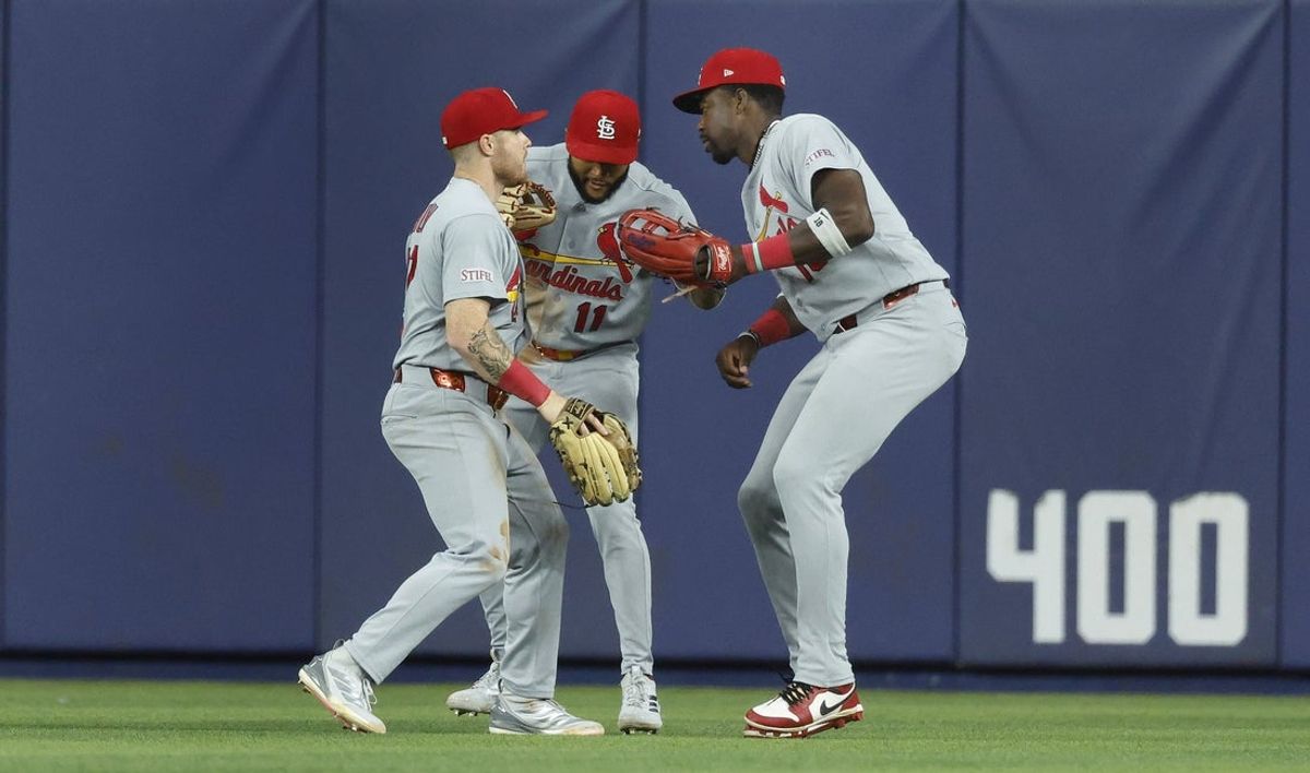 Apr 21, 2026; Miami, Florida, USA;  St. Louis Cardinals left fielder Nathan Church, center fielder Victor Scott II and right fielder Jordan Walker celebrate a win against the Miami Marlins at loanDepot Park. Mandatory Credit: Rhona Wise-Imagn Images