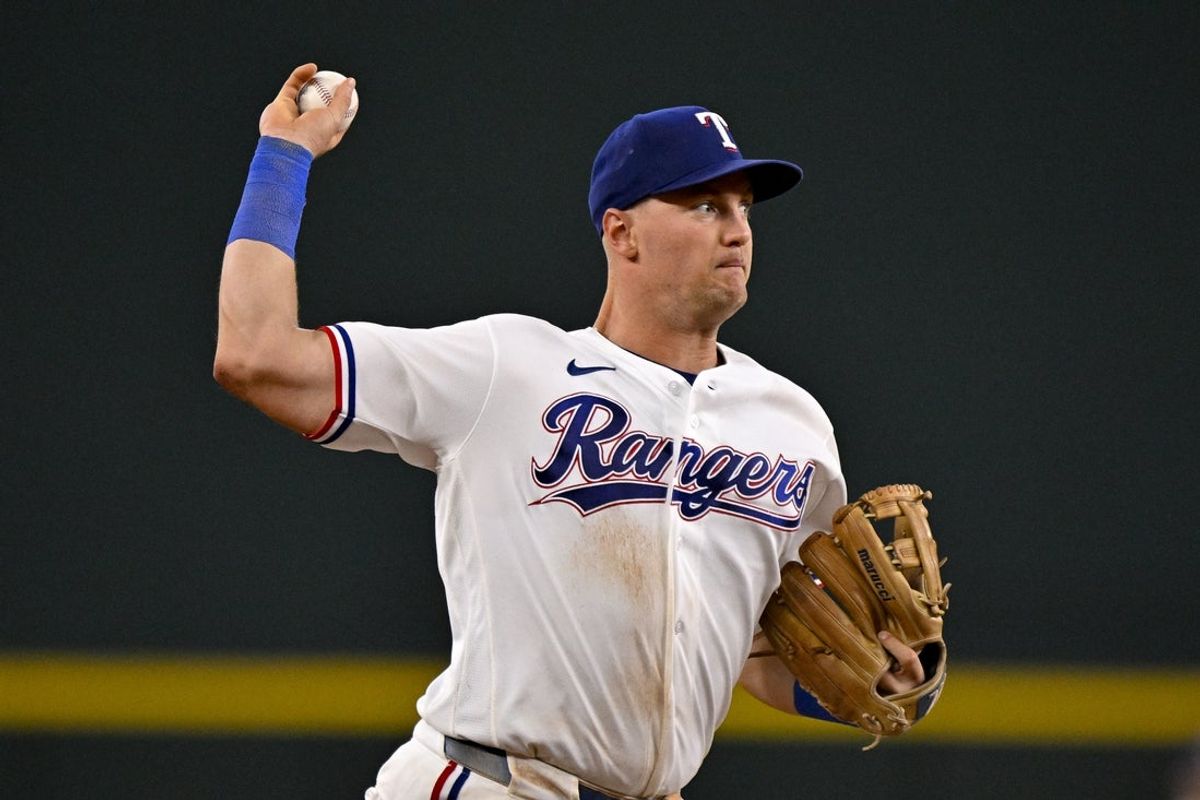 Apr 21, 2026; Arlington, Texas, USA; Texas Rangers third baseman Josh Jung (6) throws out Pittsburgh Pirates third baseman Nick Yorke (not pictured) at first base during the ninth inning at Globe Life Field. Mandatory Credit: Jerome Miron-Imagn Images