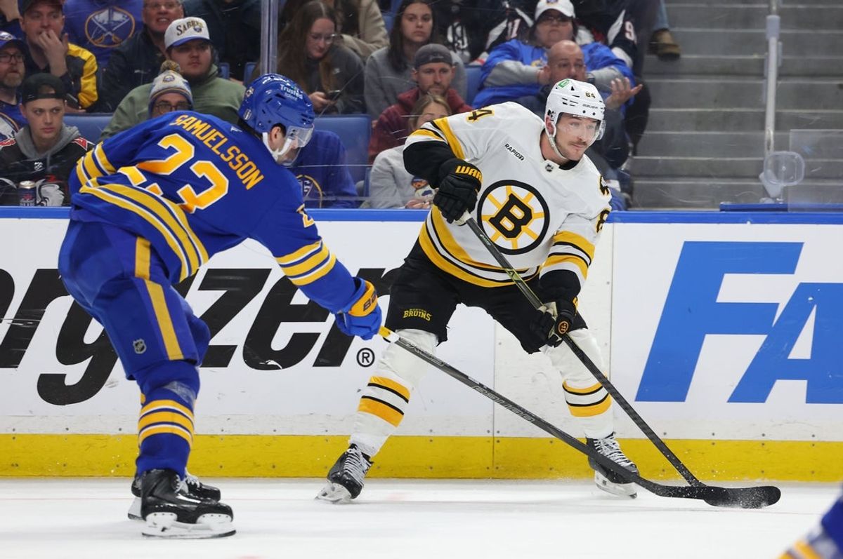 Apr 21, 2026; Buffalo, New York, USA; Buffalo Sabres defenseman Mattias Samuelsson (23) tries to block a pass by Boston Bruins left wing Tanner Jeannot (84) during the third period in game two of the first round of the 2026 Stanley Cup Playoffs at KeyBank Center. Mandatory Credit: Timothy T. Ludwig-Imagn Images