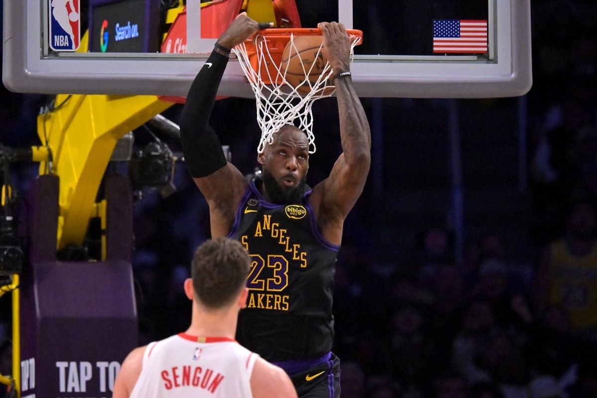 Apr 21, 2026; Los Angeles, California, USA; Los Angeles Lakers forward LeBron James (23) dunks as Houston Rockets center Alperen Sengun (28) looks on during the second half of game two of the first round of the 2026 NBA Playoffs at Crypto.com Arena. Mandatory Credit: Jayne Kamin-Oncea-Imagn Images