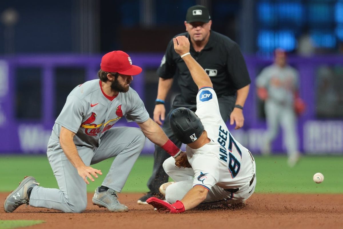 Apr 22, 2026; Miami, Florida, USA; Miami Marlins center fielder Jakob Marsee (87) steals second base against St. Louis Cardinals shortstop Thomas Saggese (25) during the fourth inning at loanDepot Park. Mandatory Credit: Sam Navarro-Imagn Images