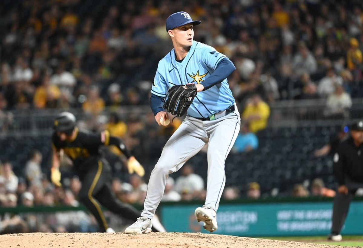 Apr 17, 2026; Pittsburgh, Pennsylvania, USA;  Tampa Bay Rays relief pitcher Griffin Jax throws as Pittsburgh Pirates shortstop Konnor Griffin steals second during the sixth inning at PNC Park. Mandatory Credit: Philip G. Pavely-Imagn Images