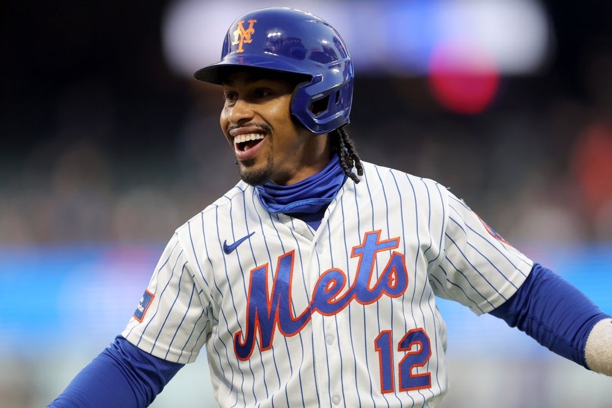 Apr 22, 2026; New York City, New York, USA; New York Mets shortstop Francisco Lindor (12) reacts after his RBI infield single against the Minnesota Twins during the first inning at Citi Field. Mandatory Credit: Brad Penner-Imagn Images