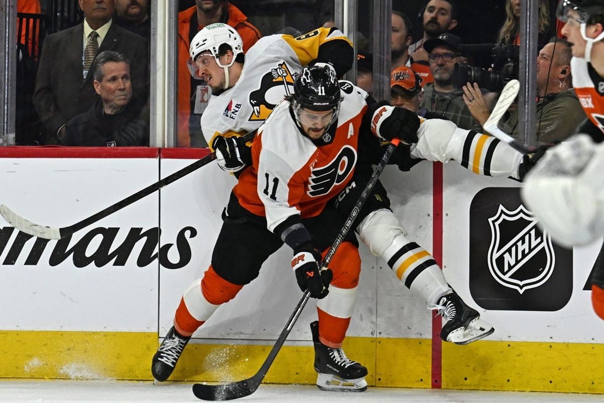 Apr 22, 2026; Philadelphia, Pennsylvania, USA; Philadelphia Flyers right wing Travis Konecny (11) checks Pittsburgh Penguins right wing Rickard Rakell (67) during the first period in game three of the first round of the 2026 Stanley Cup Playoffs at Xfinity Mobile Arena. Mandatory Credit: Eric Hartline-Imagn Images
