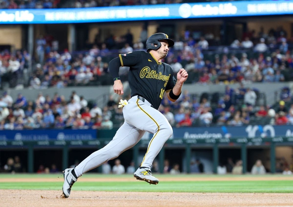 Apr 22, 2026; Arlington, Texas, USA;  Pittsburgh Pirates left fielder Bryan Reynolds (10) rounds third base and scores during the first inning against the Texas Rangers at Globe Life Field. Mandatory Credit: Kevin Jairaj-Imagn Images