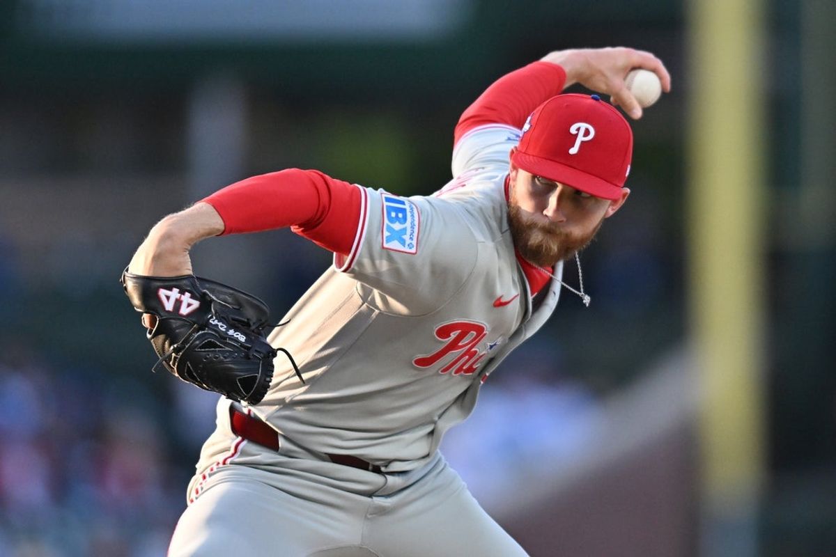 Apr 22, 2026; Chicago, Illinois, USA; Philadelphia Phillies pitcher Kyle Backhus (19) pitches against the Chicago Cubs during the first inning at Wrigley Field. Mandatory Credit: Patrick Gorski-Imagn Images