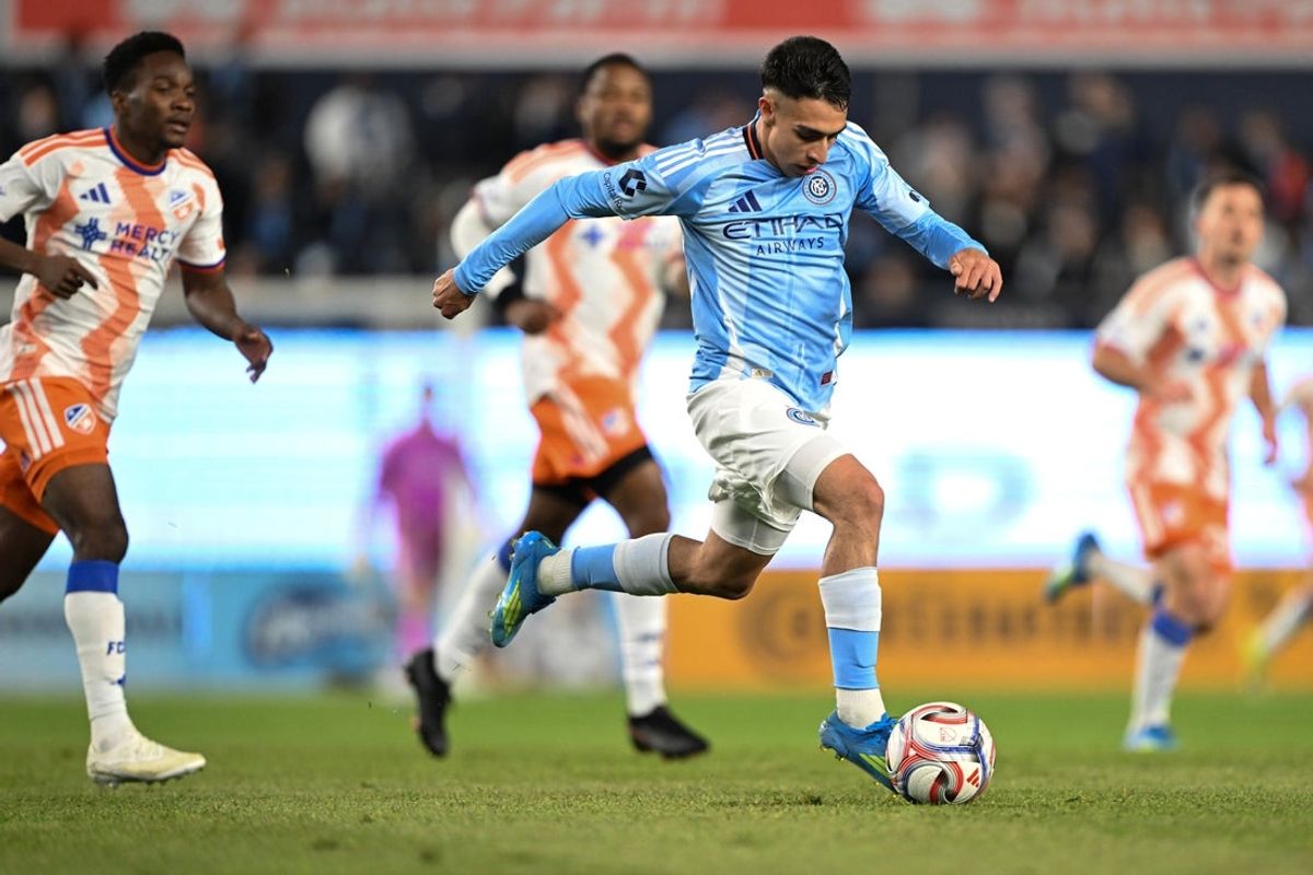 Apr 22, 2026; New York, New York, USA; New York City FC forward Agustín Ojeda (26) runs with the ball during the first half against FC Cincinnati at Yankee Stadium. Mandatory Credit: Mark Smith-Imagn Images