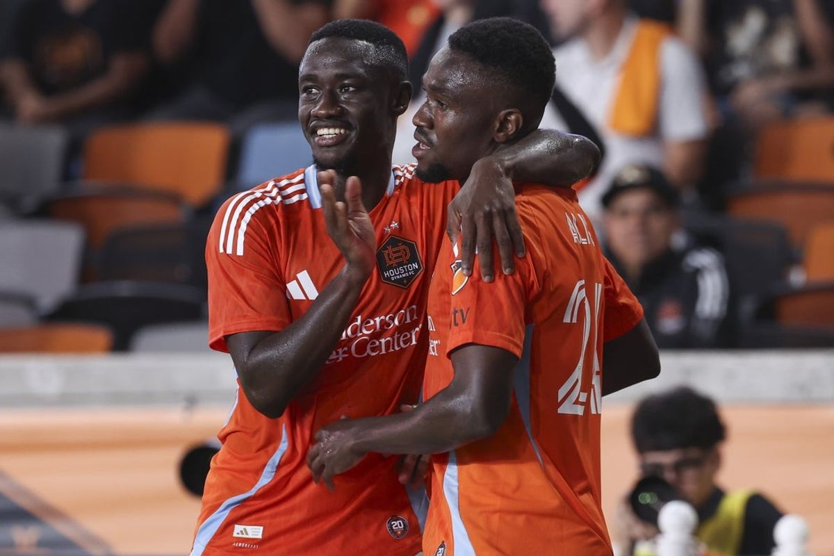 Apr 22, 2026; Houston, Texas, USA; Houston Dynamo FC forward Ibrahim Aliyu (24) celebrates with defender Diadie Samassekou (18) after scoring a goal during the first half against the San Diego FC at Shell Energy Stadium. Mandatory Credit: Troy Taormina-Imagn Images