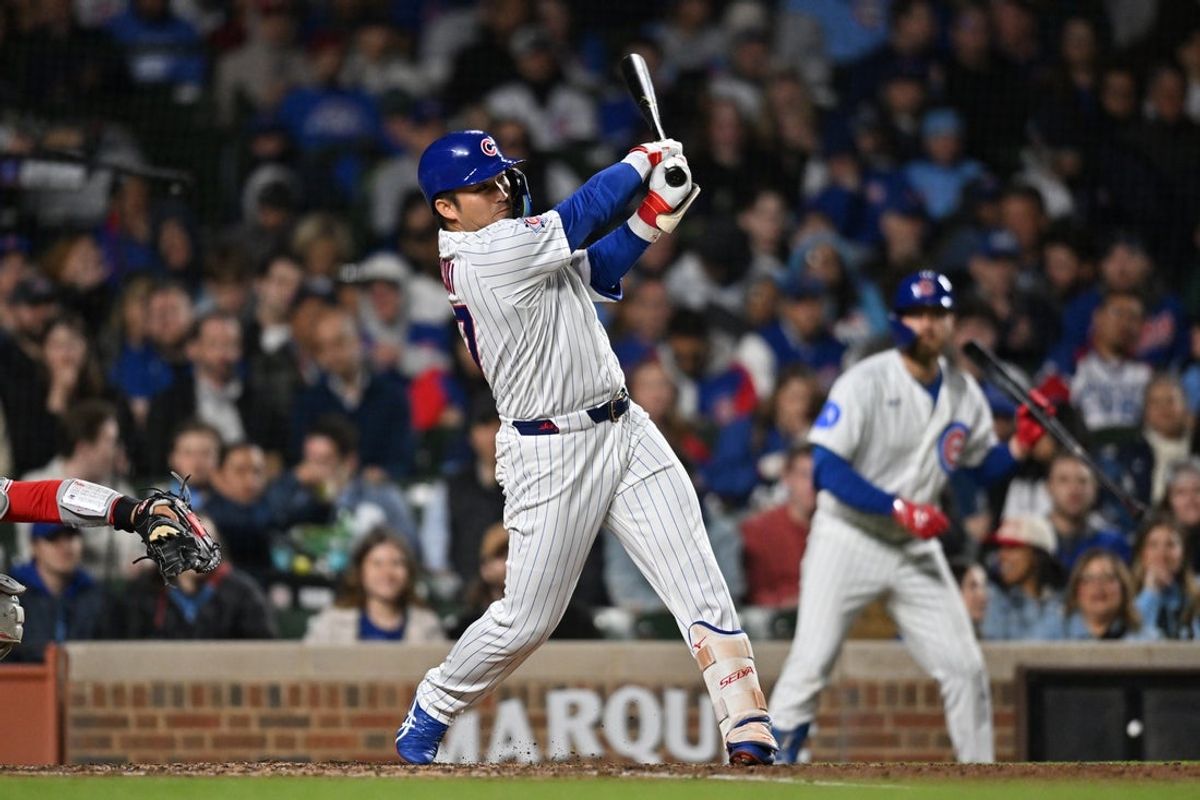 Apr 22, 2026; Chicago, Illinois, USA; Chicago Cubs right fielder Seiya Suzuki (27) hits a two-run home run against the Philadelphia Phillies during the fifth inning at Wrigley Field. Mandatory Credit: Patrick Gorski-Imagn Images