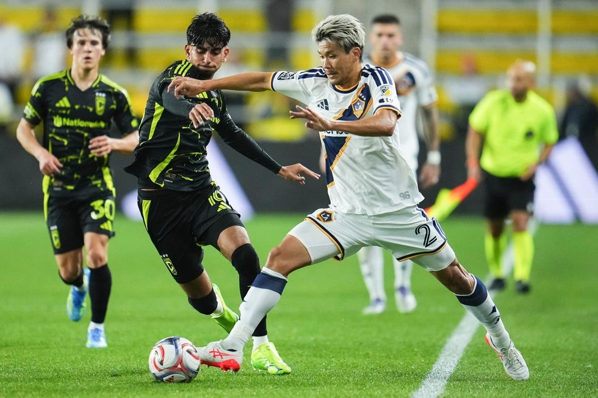 LA Galaxy defender Miki Yamane (2) interrupts the dribble of Columbus Crew midfielder Taha Habroune (16) during the weather-delayed MLS match at ScottsMiracle-Gro Field in Columbus on April 22, 2026.