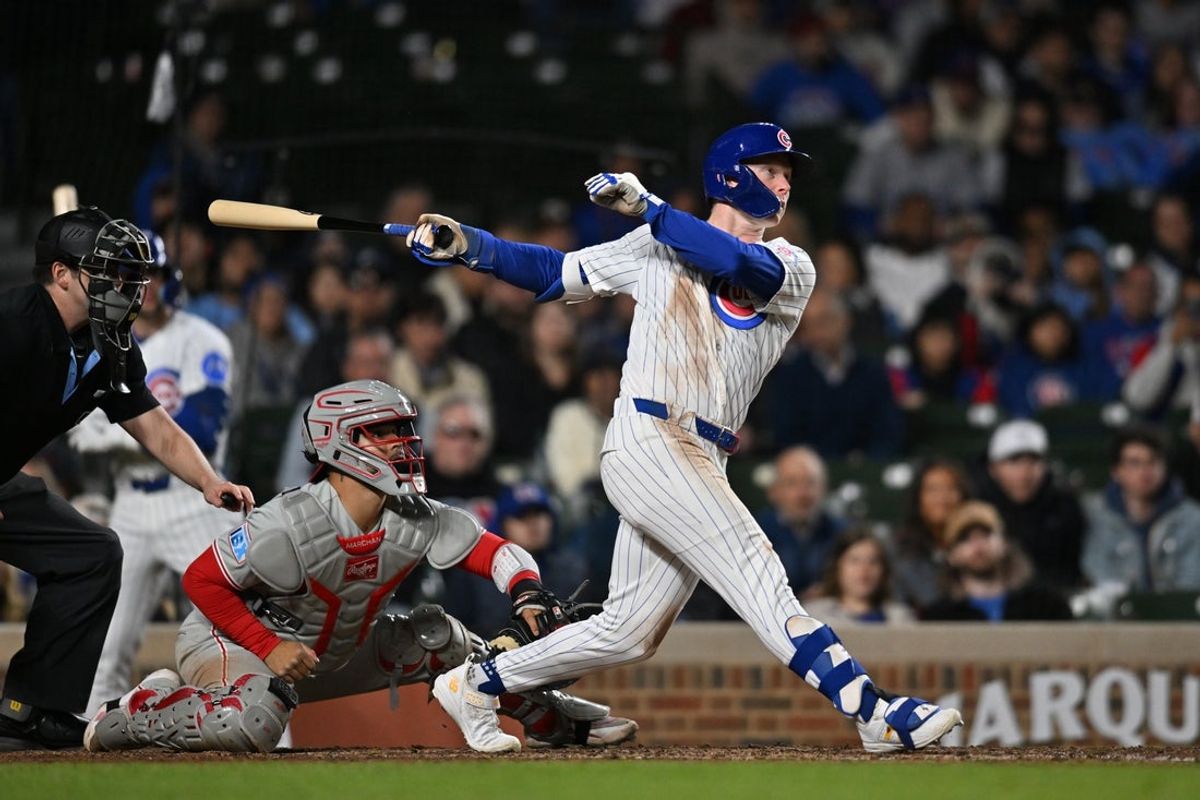 Apr 22, 2026; Chicago, Illinois, USA; Chicago Cubs center fielder Pete Crow-Armstrong (4) hits an RBI single against the Philadelphia Phillies during the eighth inning at Wrigley Field. Mandatory Credit: Patrick Gorski-Imagn Images