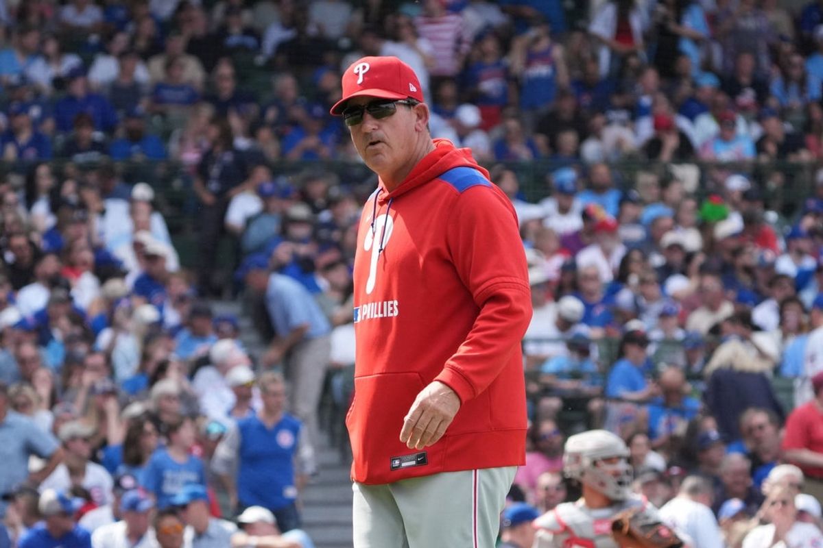 Apr 23, 2026; Chicago, Illinois, USA; Philadelphia Phillies manager Rob Thomson (49) makes a pitching change against the Chicago Cubs during the sixth inning at Wrigley Field. Mandatory Credit: David Banks-Imagn Images