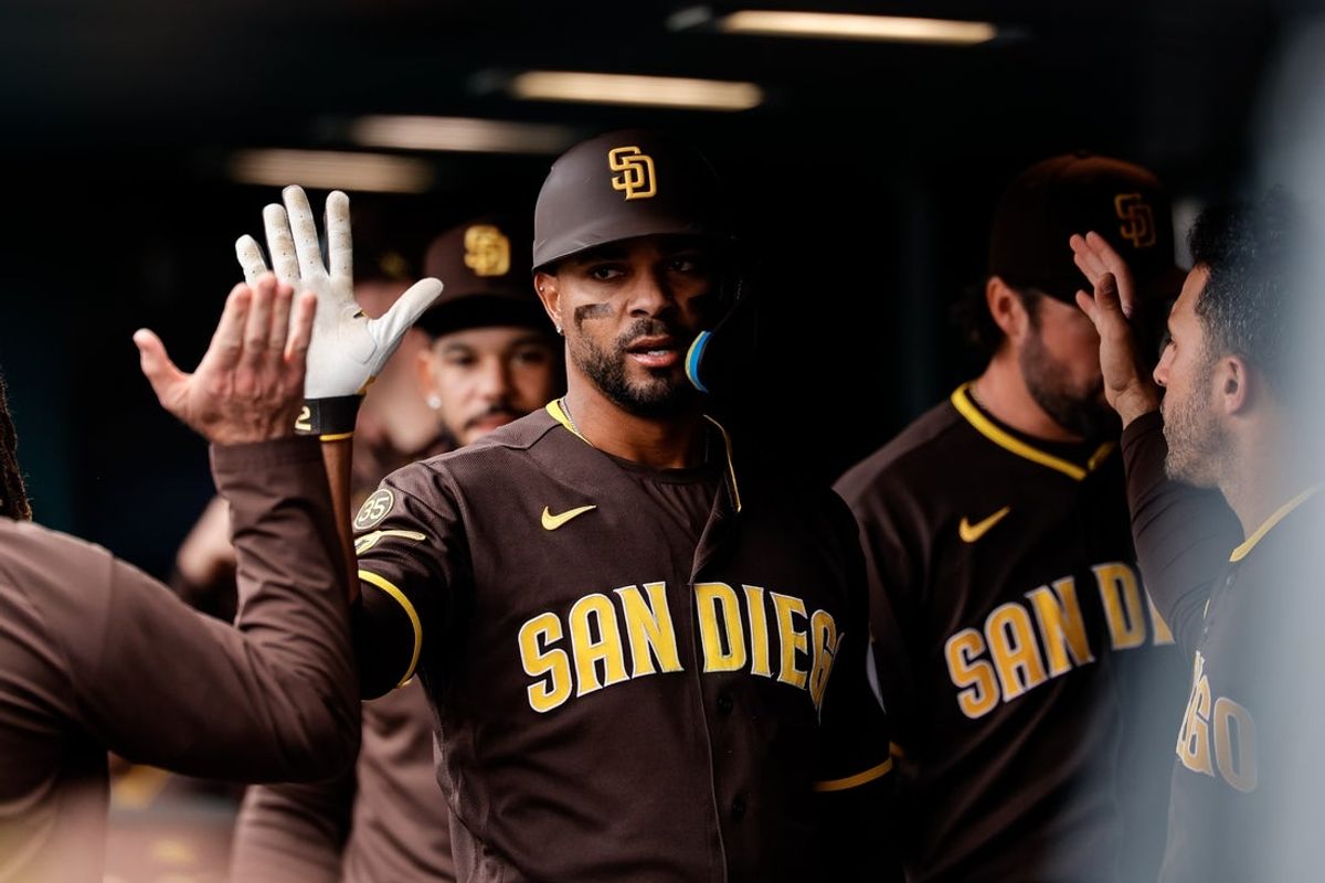 Apr 23, 2026; Denver, Colorado, USA; San Diego Padres shortstop Xander Bogaerts (2) celebrates in the dugout on a solo home run in the fifth inning against the Colorado Rockies at Coors Field. Mandatory Credit: Isaiah J. Downing-Imagn Images
