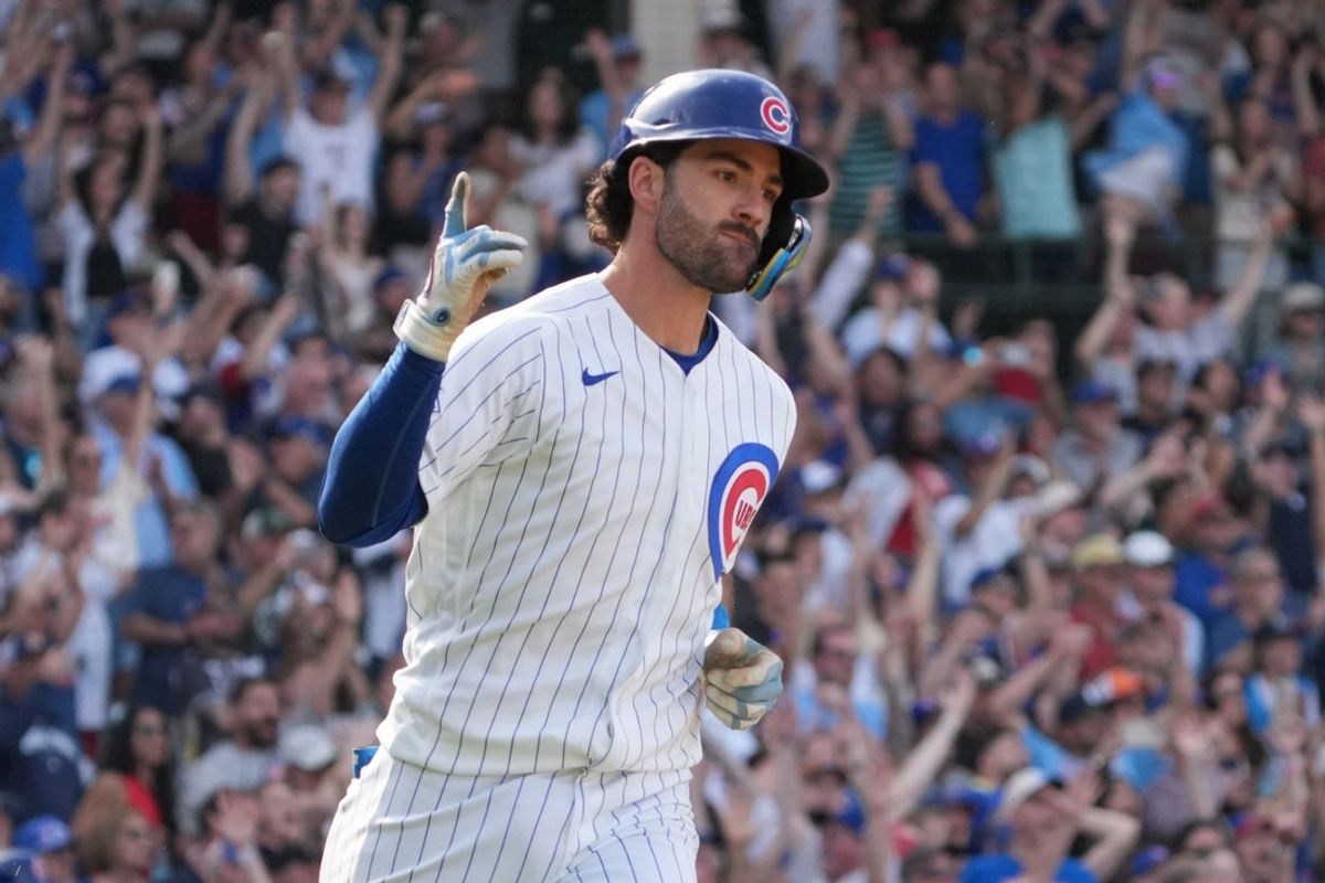 Apr 23, 2026; Chicago, Illinois, USA; Chicago Cubs shortstop Dansby Swanson (7) hits a walk-off single against the Philadelphia Phillies during the tenth inning at Wrigley Field. Mandatory Credit: David Banks-Imagn Images