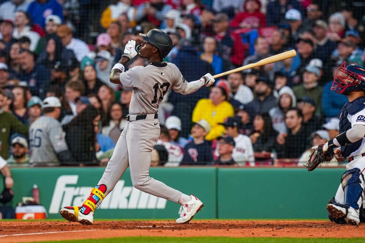 Apr 23, 2026; Boston, Massachusetts, USA; New York Yankees second baseman Jazz Chisholm Jr. (13) hits a home run against the Boston Red Sox in the fifth inning at Fenway Park. Mandatory Credit: David Butler II-Imagn Images