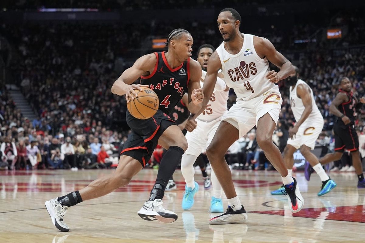 Apr 23, 2026; Toronto, Ontario, CAN; Toronto Raptors guard Scottie Barnes (4) drives to the basket against Cleveland Cavaliers forward Evan Mobley (4) during the first half of game three of the first round of the 2026 NBA Playoffs at Scotiabank Arena. Mandatory Credit: John E. Sokolowski-Imagn Images