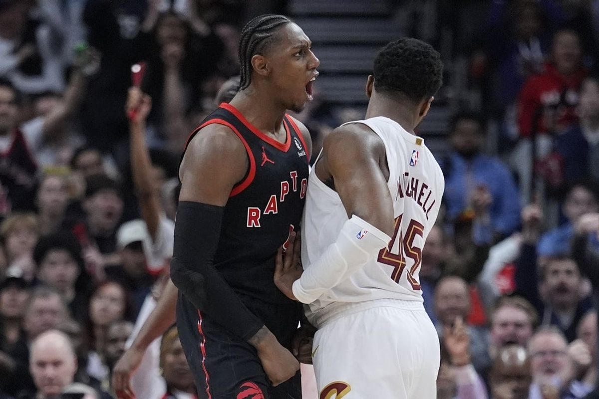 Apr 23, 2026; Toronto, Ontario, CAN; Toronto Raptors forward RJ Barrett (9) celebrates as Cleveland Cavaliers guard Donovan Mitchell (45) tries to walk away during the second half of game three of the first round of the 2026 NBA Playoffs at Scotiabank Arena. Mandatory Credit: John E. Sokolowski-Imagn Images
