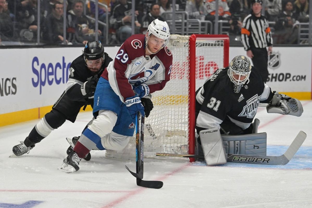 Apr 23, 2026; Los Angeles, California, USA; Colorado Avalanche center Nathan MacKinnon (29) is chased down by Los Angeles Kings defenseman Drew Doughty (8) as he skates the puck toward Los Angeles Kings goaltender Anton Forsberg (31) in the first period of game three of the first round of the 2026 Stanley Cup Playoffs at Crypto.com Arena. Mandatory Credit: Jayne Kamin-Oncea-Imagn Images