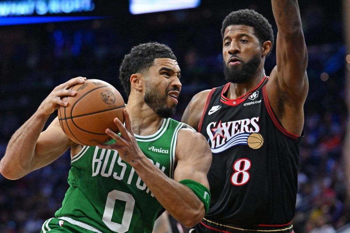 Apr 24, 2026; Philadelphia, Pennsylvania, USA; Boston Celtics forward Jayson Tatum (0) drives to the basket  against Philadelphia 76ers forward Paul George (8) during the first half at Xfinity Mobile Arena. Mandatory Credit: Eric Hartline-Imagn Images