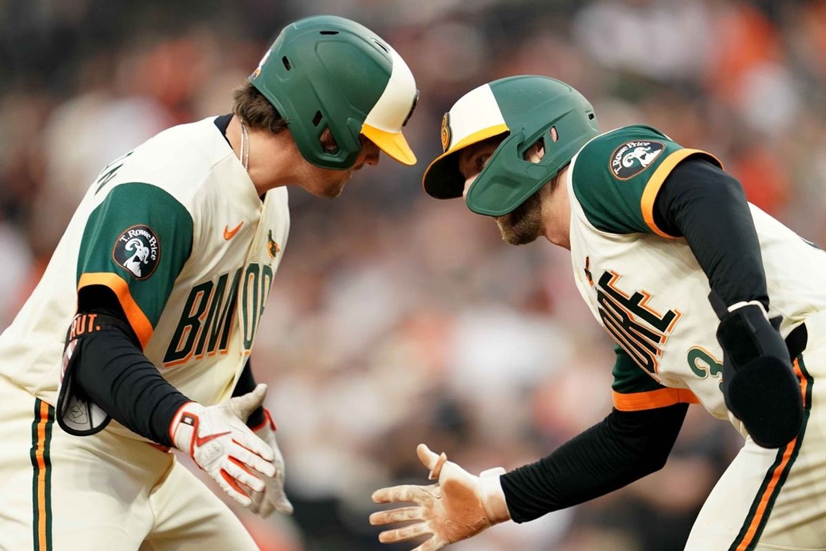 Apr 24, 2026; Baltimore, Maryland, USA; Baltimore Orioles catcher Adley Rutschman (35) greeted by outfielder Taylor Ward (3) following his two-run home run during the first inning against the Boston Red Sox at Oriole Park at Camden Yards. Mandatory Credit: Mitch Stringer-Imagn Images