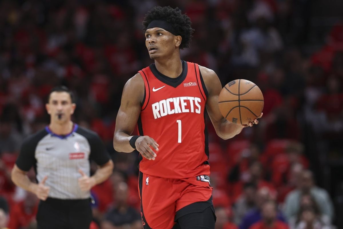 Apr 24, 2026; Houston, Texas, USA; Houston Rockets guard/forward Amen Thompson (1) controls the ball during the first quarter against the Los Angeles Lakers during game three of the first round of the 2026 NBA Playoffs at Toyota Center. Mandatory Credit: Troy Taormina-Imagn Images
