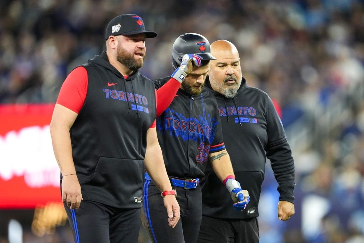 Apr 24, 2026; Toronto, Ontario, CAN; Toronto Blue Jays right fielder Nathan Lukes (38) leaves the game after sliding into second base against the Cleveland Guardians during the first inning at Rogers Centre. Mandatory Credit: Kevin Sousa-Imagn Images