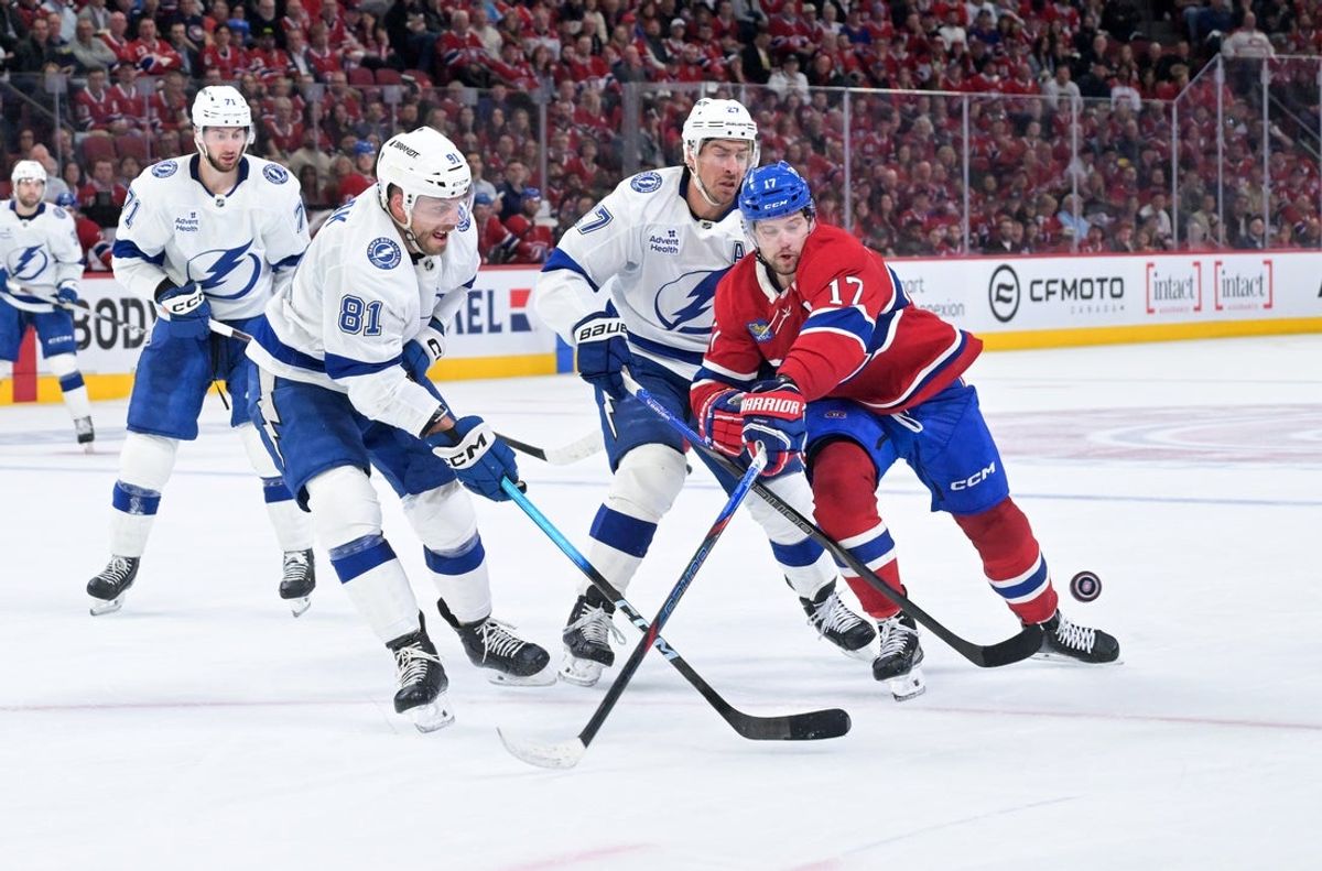 Apr 24, 2026; Montreal, Quebec, CAN; Montreal Canadiens forward Josh Anderson (17) plays the puck and Tampa Bay Lightning defenseman Erik Cernak (81) defends during the third period in game three of the first round of the 2026 Stanley Cup Playoffs at the Bell Centre. Mandatory Credit: Eric Bolte-Imagn Images