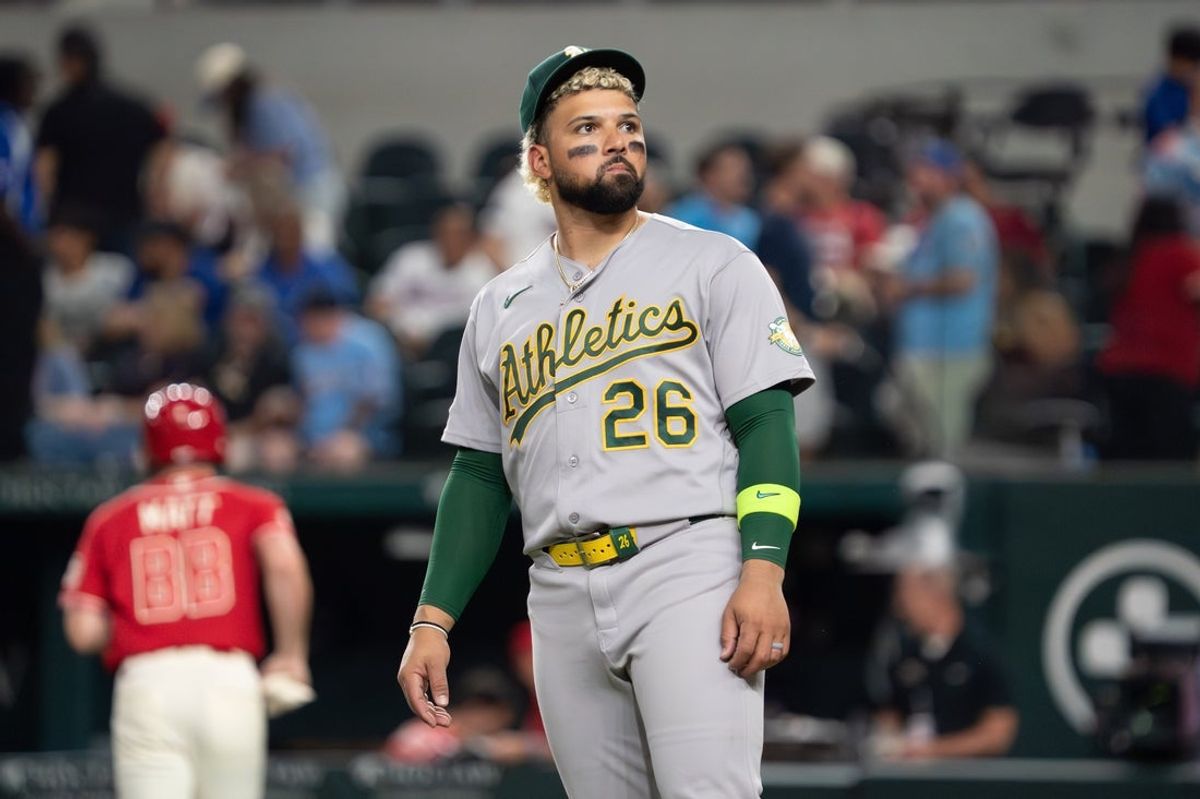 Apr 24, 2026; Arlington, Texas, USA; Athletics left fielder Carlos Cortes (26) stands on the field after a game against the Texas Rangers at Globe Life Field. Cortes had a two home run and four RBI game. Mandatory Credit: Raymond Carlin III-Imagn Images