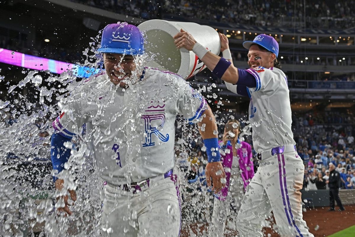 Apr 24, 2026; Kansas City, Missouri, USA;  Kansas City Royals shortstop Bobby Witt Jr. (7) douses left fielder Isaac Collins (1) with ice water after beating the Los Angeles Angels at Kauffman Stadium. Mandatory Credit: Peter Aiken-Imagn Images
